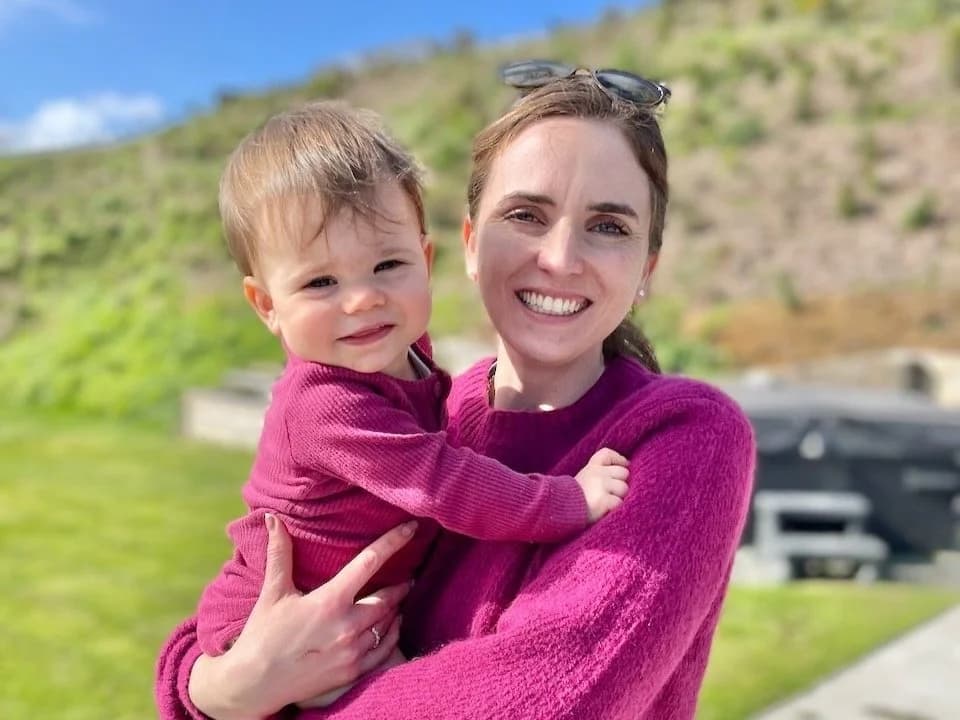 Julia holding her daughter